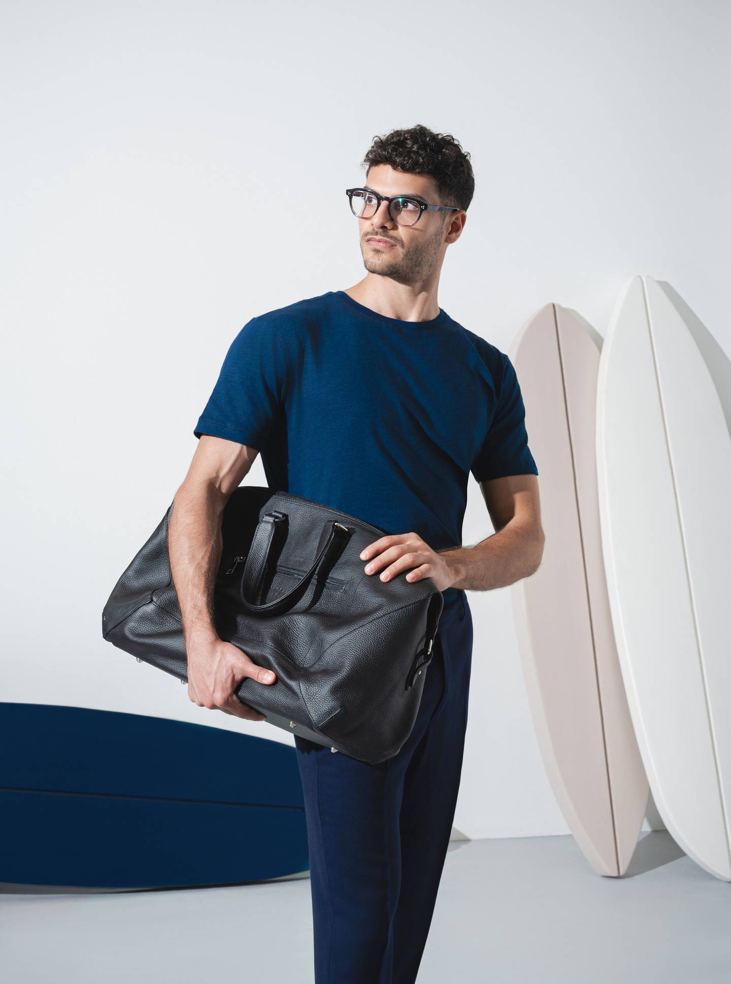 Back to work, refined. Our minimal tee paired with the leather executive bag, where function meets understated style.